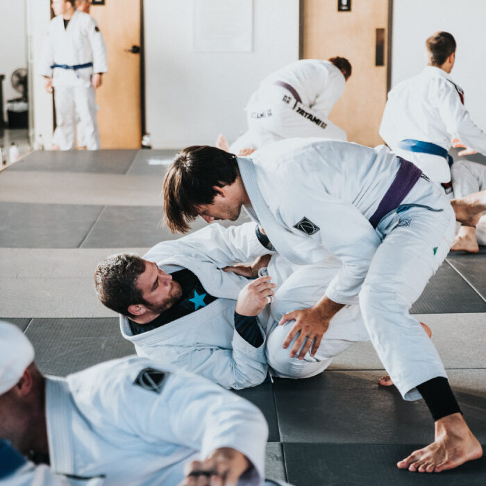 A group of people practicing jujitsu 1